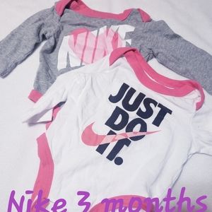 2 Nike long sleeve onesies